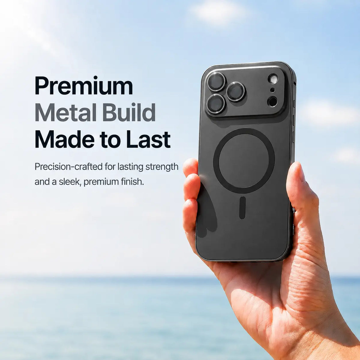 Black metal magnetic phone case held upright beside the sea with a material feature caption #color_Midnight Black