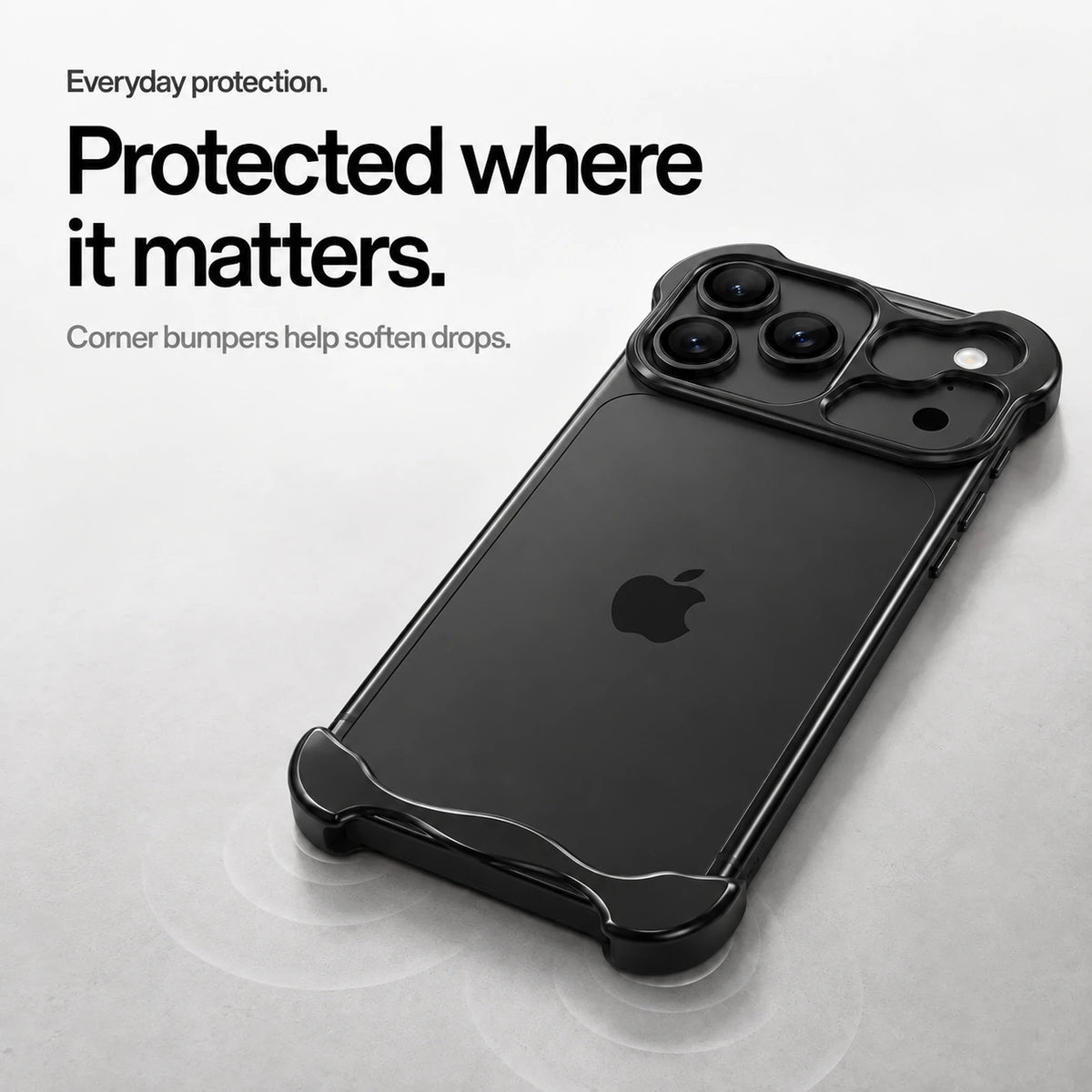 Black sculpted metal phone case on a desk showing its protective corner bumpers #color_Midnight Black