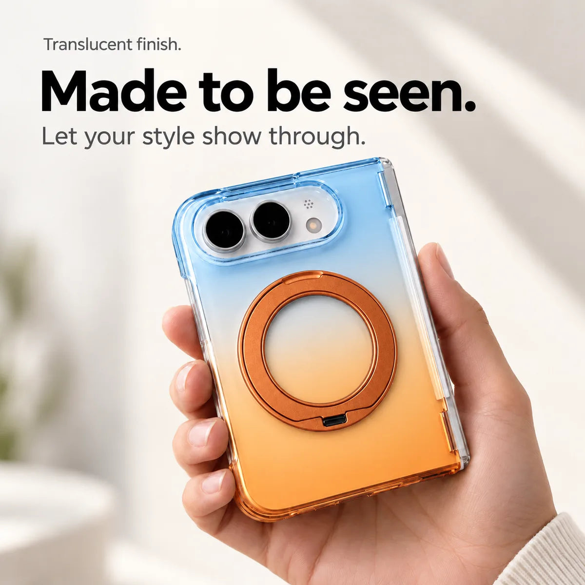 Blue and orange gradient translucent rear case held in a hand with the ring folded closed. #color_Solar Haze