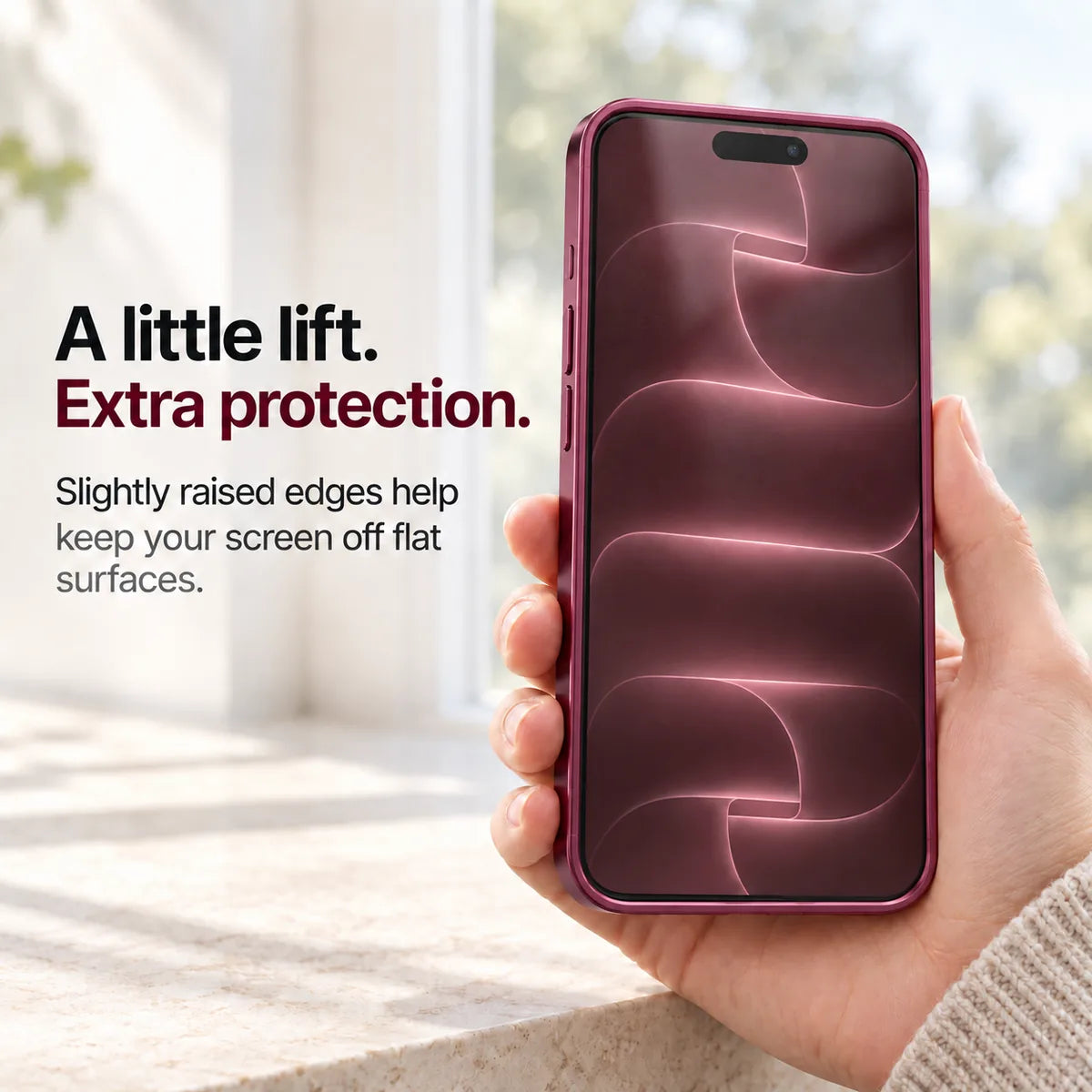 Burgundy metal phone case held with the front display and raised screen edges visible #color_Burgundy