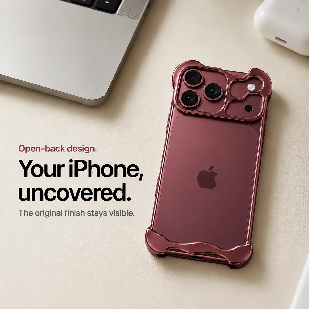 Burgundy sculpted metal phone case on a desk showing the open back #color_Burgundy