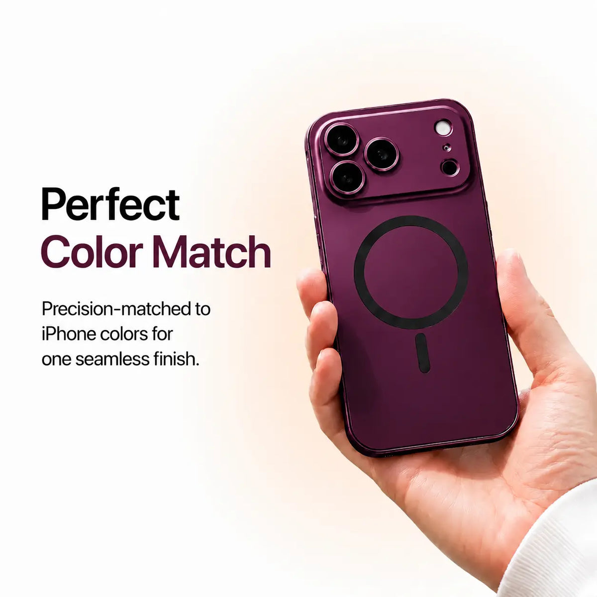 Burgundy metal magnetic phone case held in one hand against a pale studio background #color_Burgundy