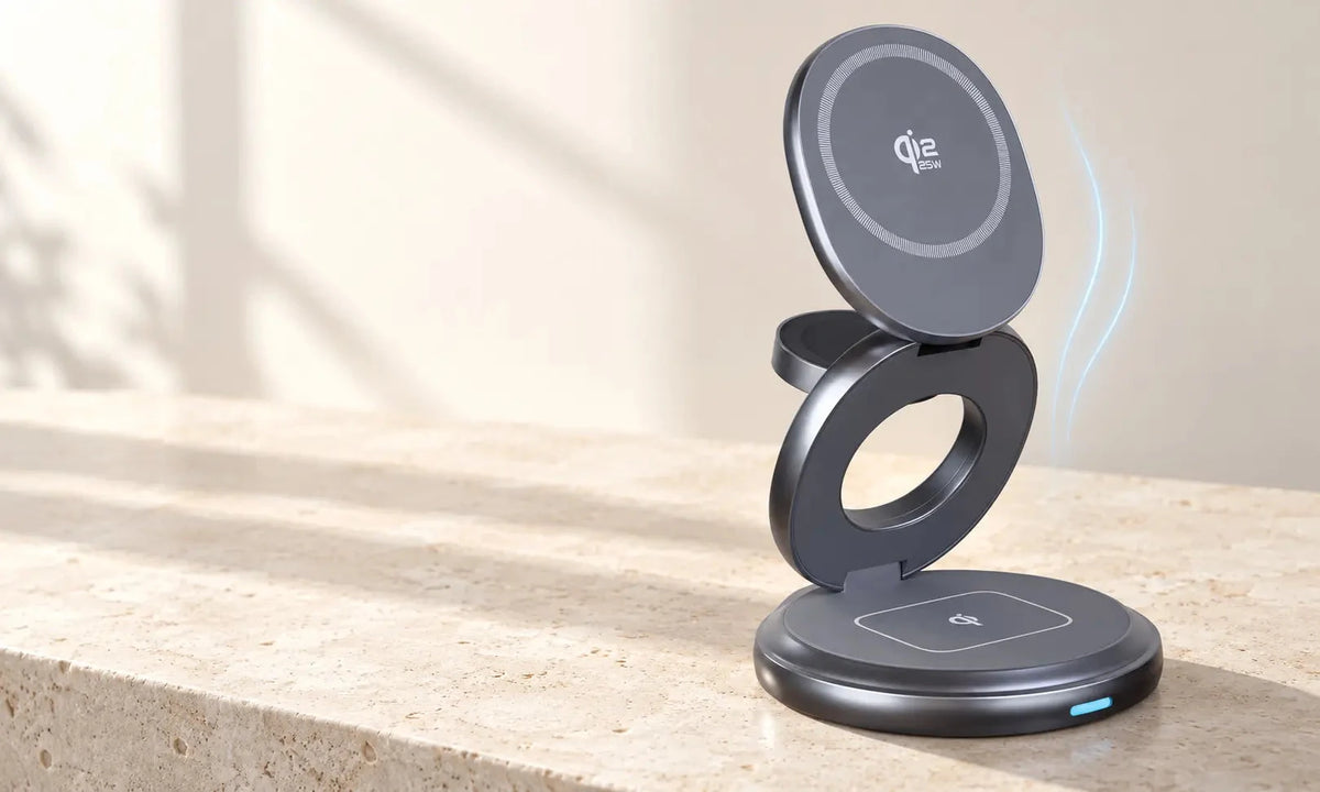 Gray circular magnetic charging stand opened upright on a pale stone surface.