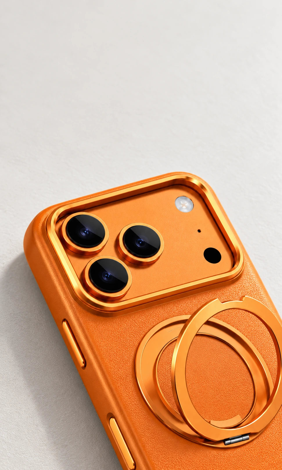 Raised orange camera surround and lens rings on a leather phone case.