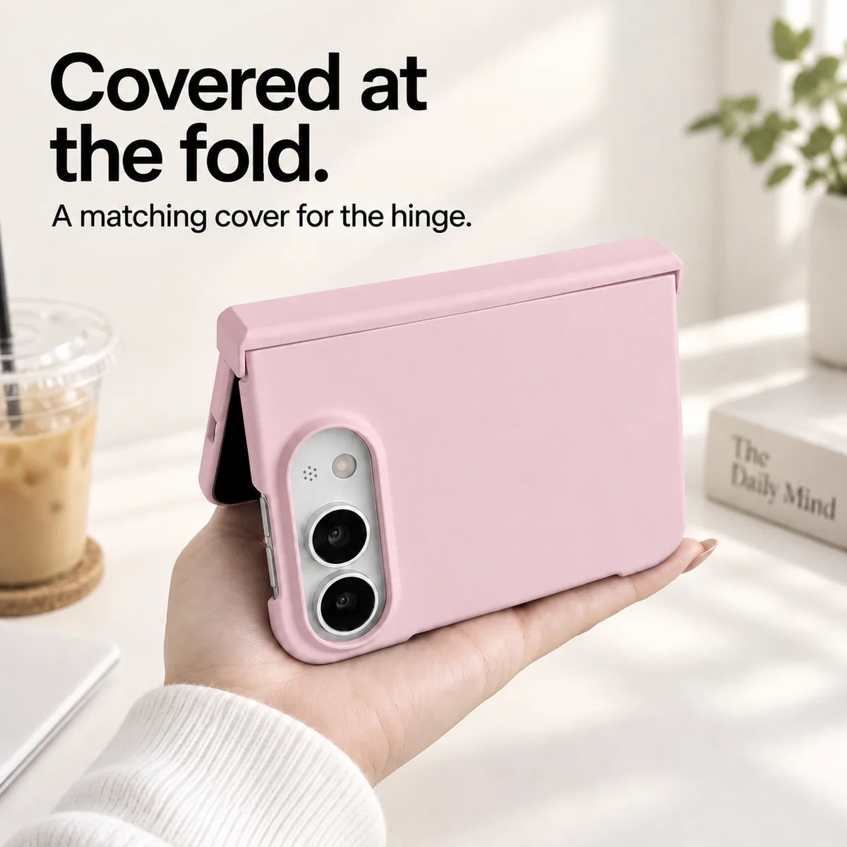 Pink iPhone Ultra case held partly folded, showing the matching cover along the hinge. #color_Petal Pink