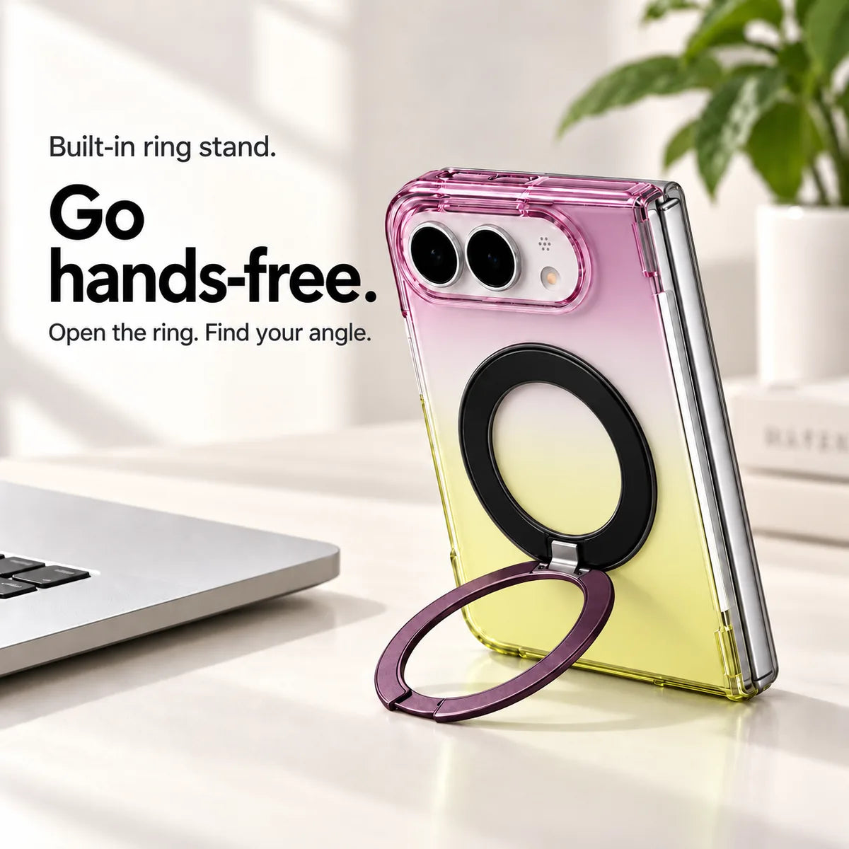 Purple and yellow gradient case supporting a folded silver phone on a desk with its ring stand open. #color_Orchid Glow