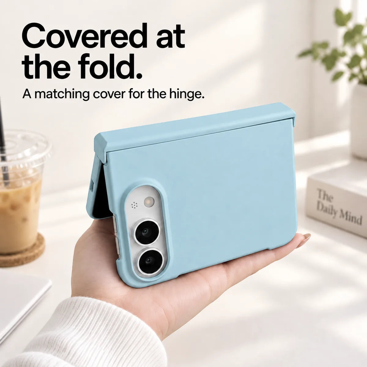 Sky Blue iPhone Ultra case held partly folded, showing the matching cover along the hinge. #color_Glacier Blue