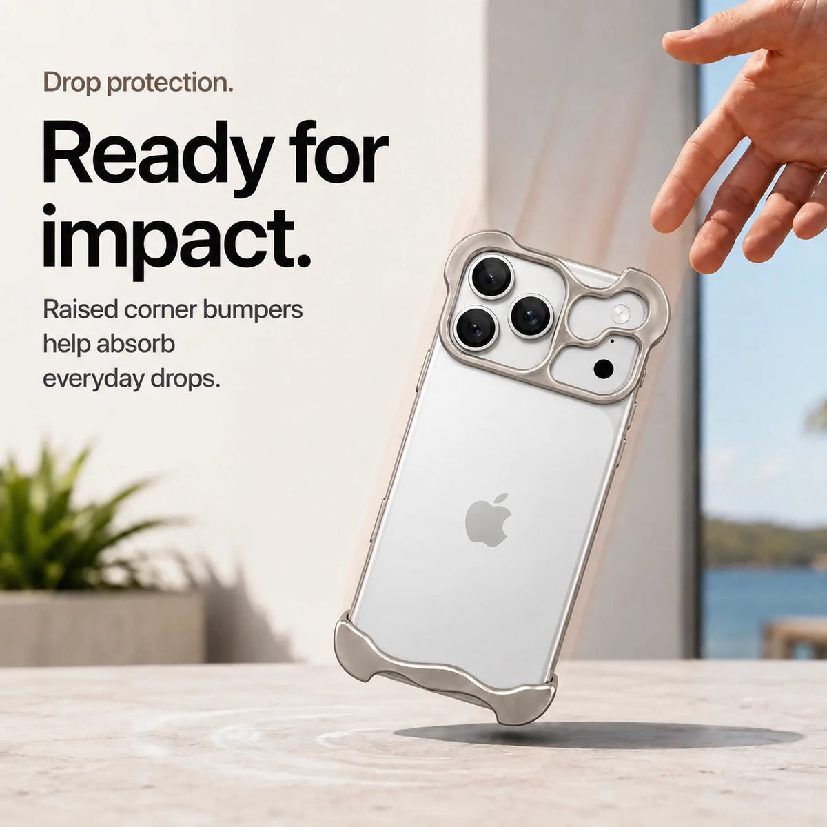 Warm gray sculpted metal phone case demonstrating raised corner protection during a drop #color_Natural Titanium