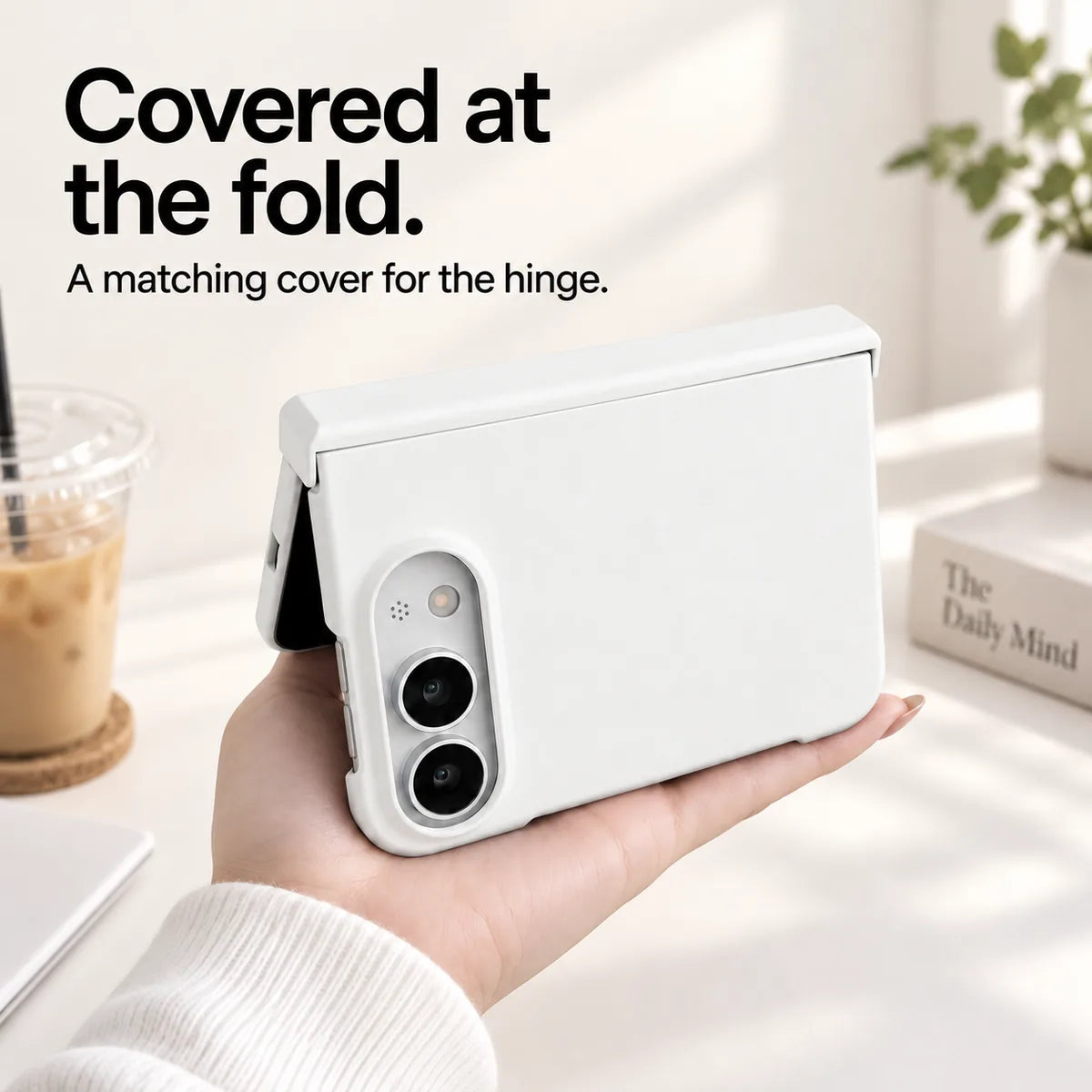 White iPhone Ultra case held partly folded, showing the matching cover along the hinge. #color_Porcelain White