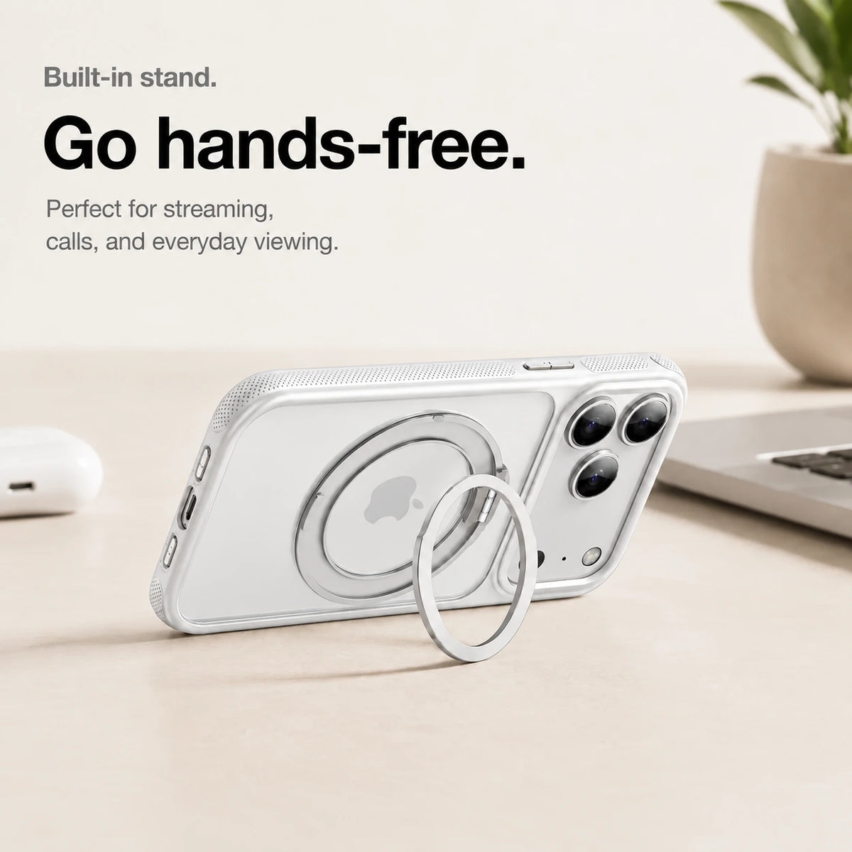 White magnetic phone case propped horizontally on its ring stand beside a laptop #color_Polar White